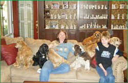 Lynne, son Alex, and her Cocker Spaniel crew!
