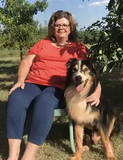 Shiela and her Australian Shepherd rescue, Riz.