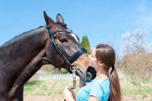 Girl cudding with her horse