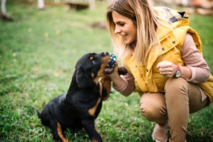 Woman playing with her dog
