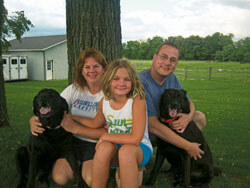The Hoffman family pose under their favorite tree. L to R: Mollie, Renee, Erin-Leigh, Mark and Gizzybear