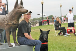 Marilyn and Tsunami sitting by her statue.