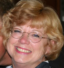 Joan is all smiles.