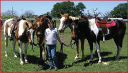 Jean's daughter, Amanda, with their happy, healthy crew down on the farm.